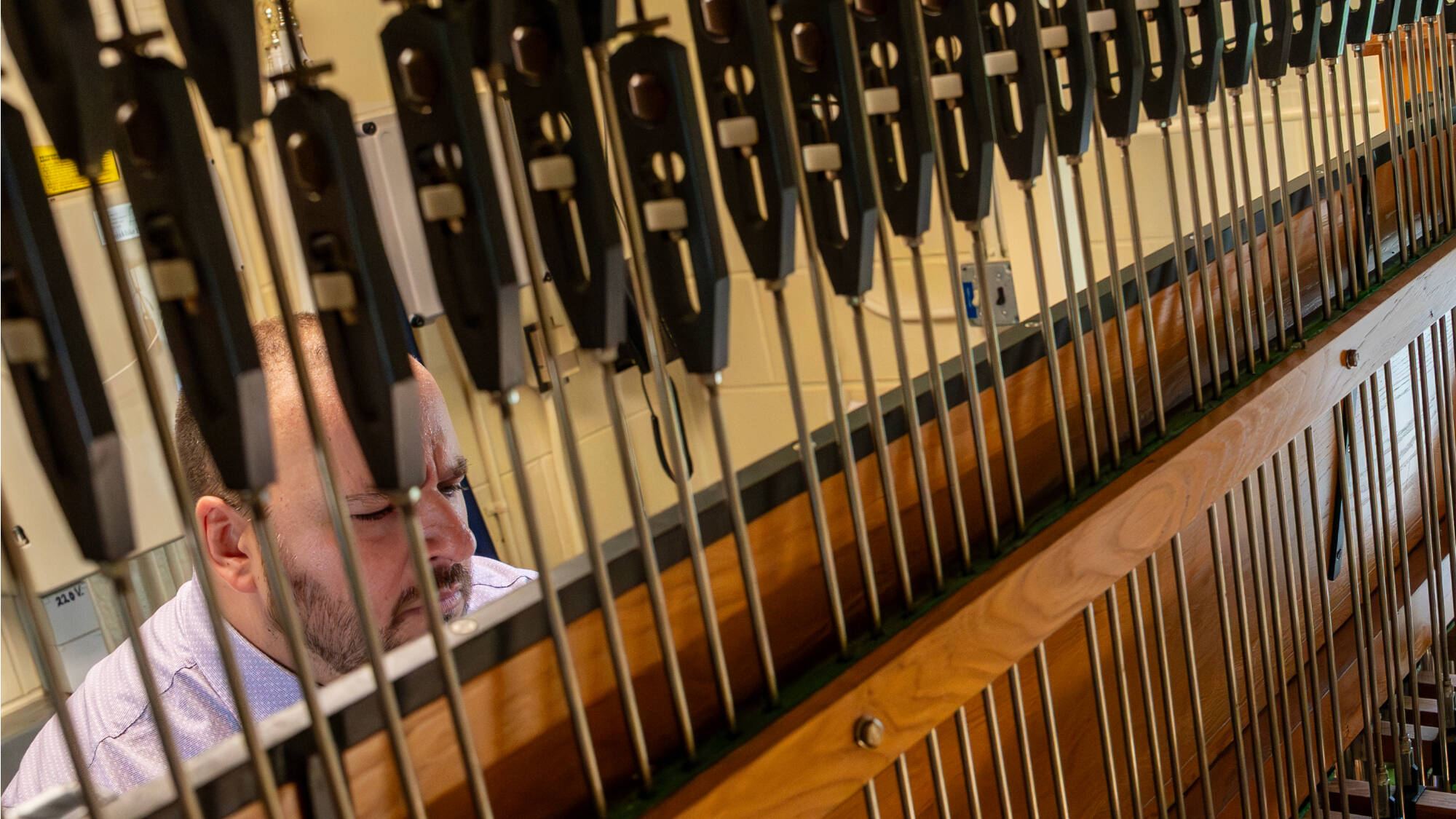New GVSU carillonneur Jon Lehrer practices inside the Cook Carillon Tower on June 10.